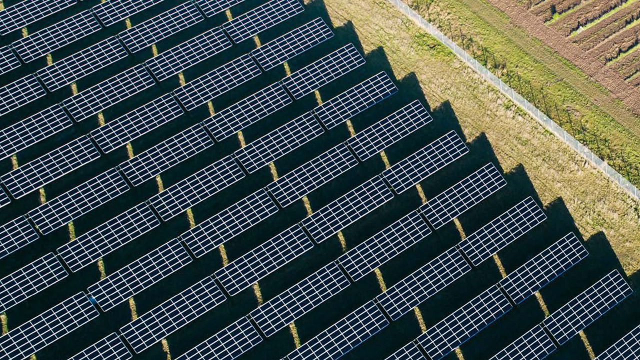 View of solar installation. Hybrid power plant also integrates a PV system and two battery storage units.