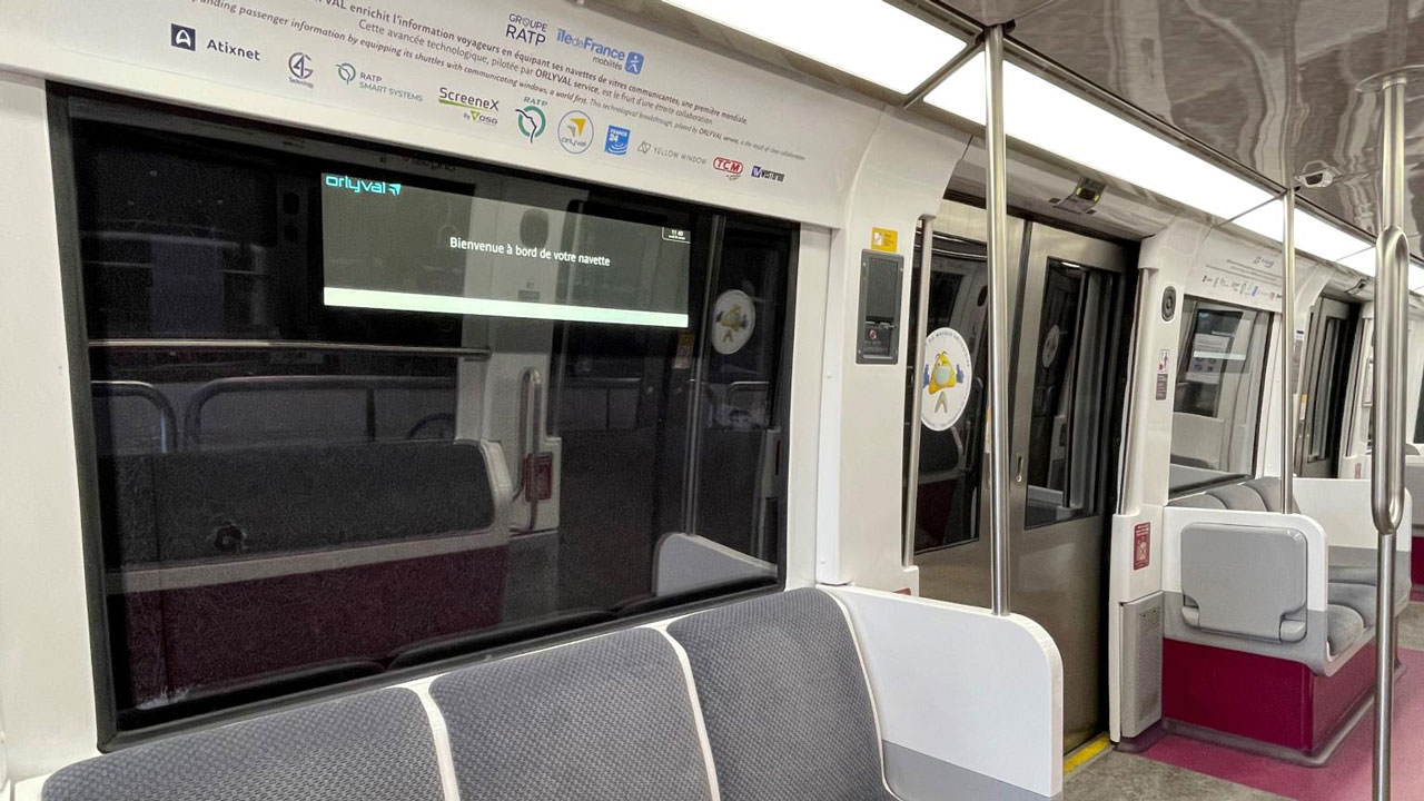 Compact Ethernet switches connect innovative LCD train windows displaying passenger information.