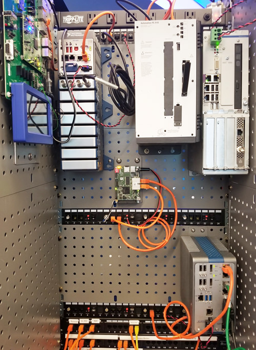 This IIC Testbed Demonstrator in Austin, Texas, shows multi-vendor products that were “plug-and-play” tested for interoperability of TSN synchronization. At center is a Hilscher netX chip-based board.
