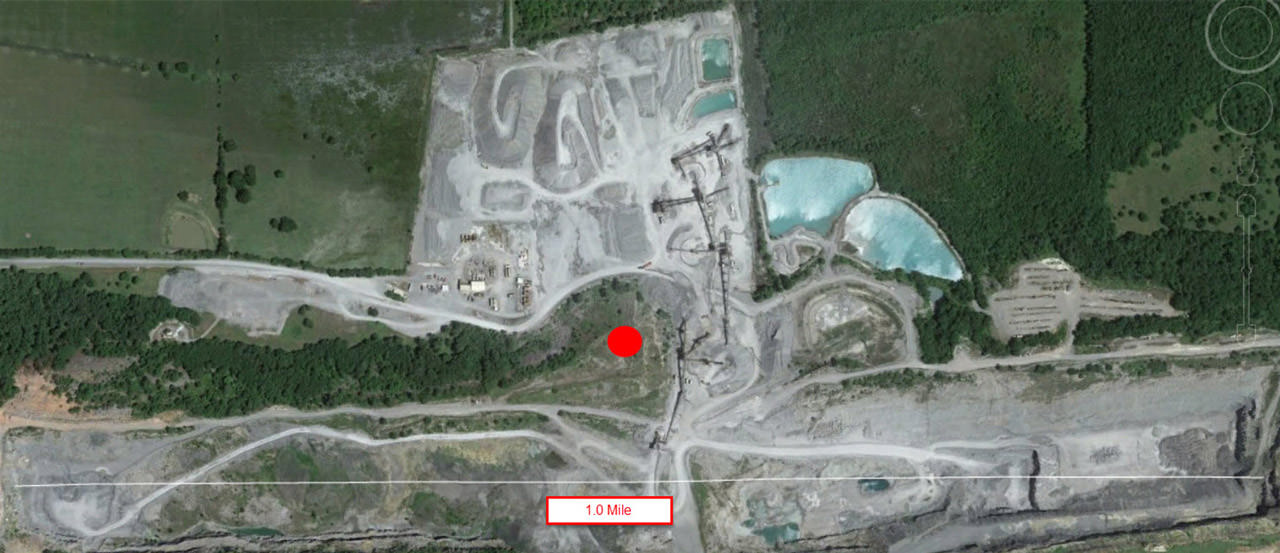 The quarry has dimensions of 1 mile by ½ mile with elevation changes of approximately 150’.