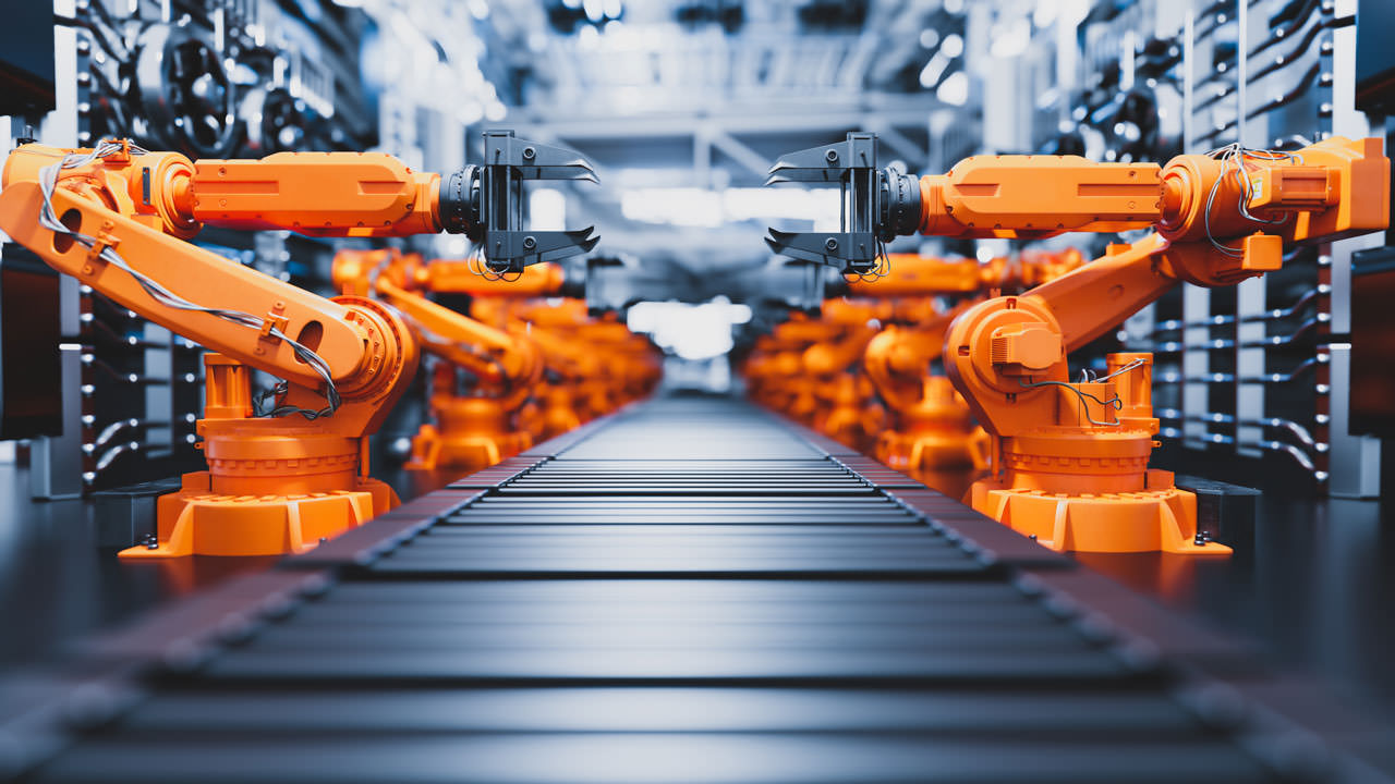 Robotic Arms Along Assembly Line In Modern Factory